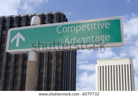 Street sign with an arrow and the words "competitive advantage" located in a business district.