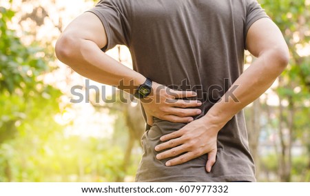Sport injury, Man with back pain Royalty-Free Stock Photo #607977332