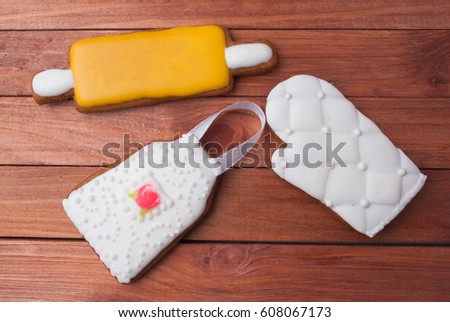 Royal icing gingerbread hand made cookie of apron, rolling pin, potholder, kitchen utensils