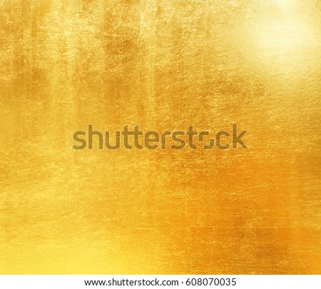 Shiny yellow leaf gold foil texture background Royalty-Free Stock Photo #608070035