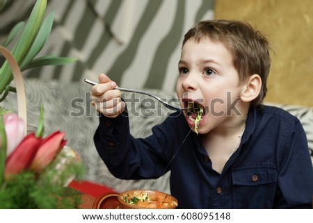 Child has baked vegetables in a cafe