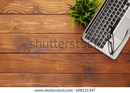Laptop, notebook on work wooden desk 