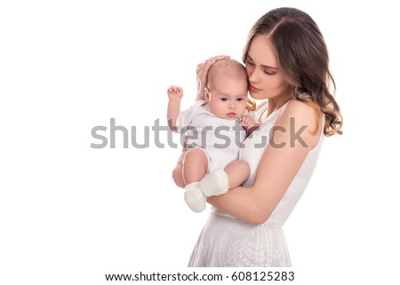 Young beautiful woman with small child in her arms. Beautiful Blonde girl in white dress smiling to your child. Isolated on white background.