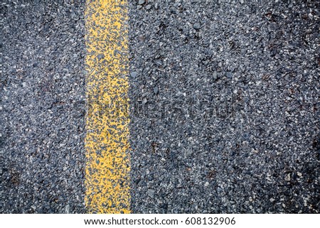 asphalt road texture with yellow stripe