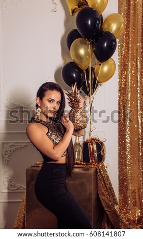Happy Glamour Woman on a gold party. Party people