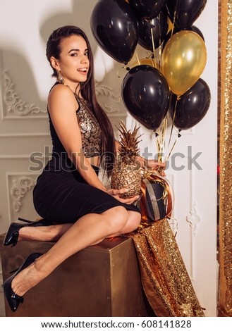 Happy Glamour Woman on a gold party. Party people