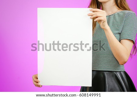 Woman showing blank white big A2 paper. Leaflet presentation. Pamphlet hold hands. Girl show clear offset paper. Sheet template. Booklet design sheet display read first person