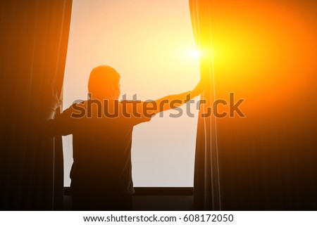 man and hope concept . man opening window curtains