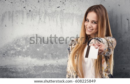 pretty young woman using a credit card