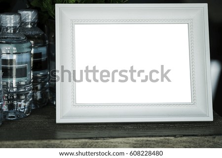 White frame on wooden table