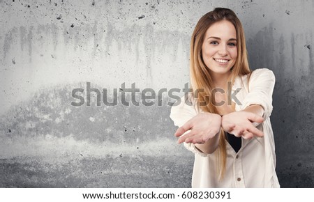 pretty young woman offering something