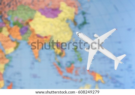 Flight to Asia symbolic image of travel by plane map.