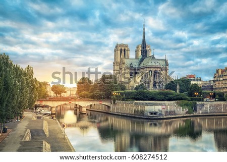 Notre Dame de Paris cathedral reflecting in river on sunrise, Paris, France Royalty-Free Stock Photo #608274512