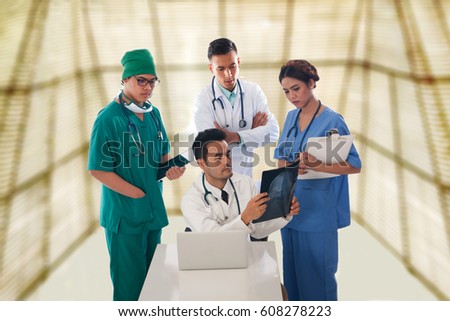 Four doctor looking at X-rays. Light background. Concept of work. 