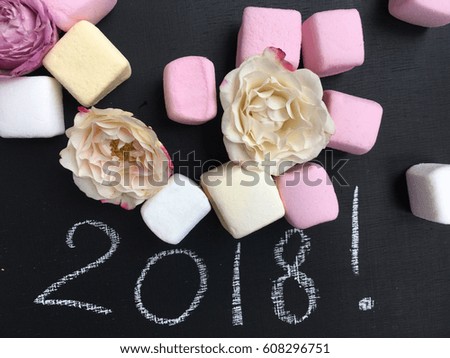 2018 marshmallow. concept 2018. 2018 chalk word. Flowers and marshmallows for 2018
