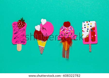 Paper ice cream on a blue background. Applique. Funny, children's pictures.
