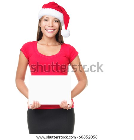 Christmas santa woman showing blank sign. Young smiling woman presenting white empty sign. Caucasian / Asian woman isolated on white background.