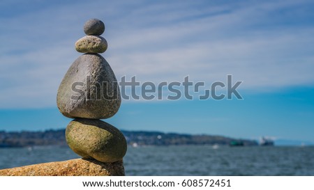 Stones balance with blue sky backgrounds