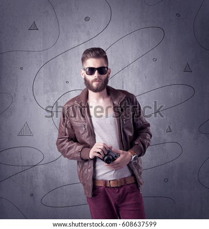 A modern young male in casual fashion style clothing making funny facial expressions while standing
