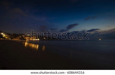 Landscape the night beach, fires of restaurants and clubs, a picture on long endurance