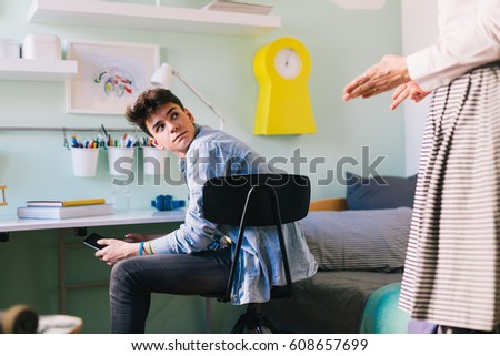 Mother argue with her teenage son Royalty-Free Stock Photo #608657699