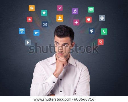 Young casual businessman with colorful applications over his head