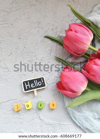 hello 2018 chalkboard with tulips on grey background. Flourish 2018. Hello 2018. Instagram 2018 with flowers wallpaper. 