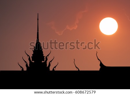 Silhouette of Thai Temple with Dramatic sunset sky.