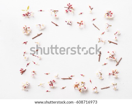 Flat lay of little flower arrangement for frame on white background, Easter spring concept