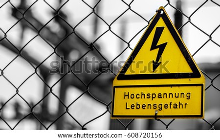 Signboard danger of high voltage - written in german language.