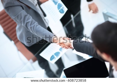 Close up view of business partnership handshake concept.Photo of two businessman handshaking process.Successful deal after great meeting