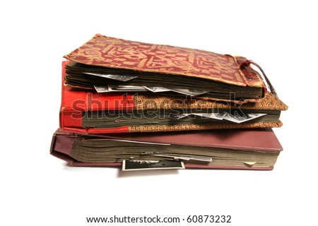 three old photo albums isolated on white background
