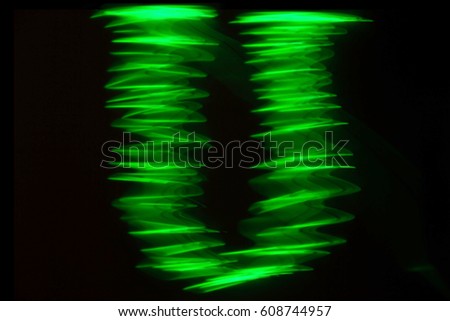 Green neon glowing letters S of the English