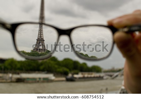The view through the glasses of the Eiffel tower with the ball during the football championship, Paris