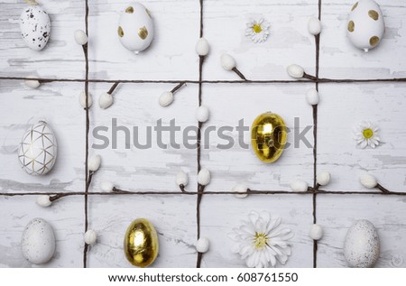 Colored eggs and decorations over wooden background. Easter day photo.