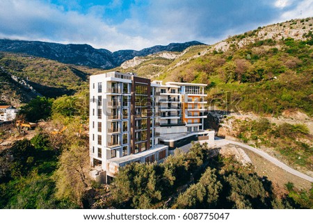 Multi-storey house on the sea. Montenegrin architecture. Real estate on the coast of Montenegro. Aerial Photo Property drone.