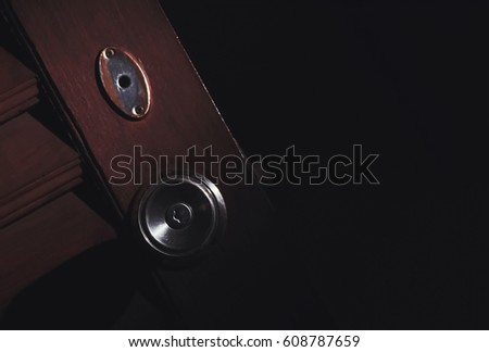 wooden door open in the dark