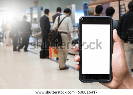 people hands use cellphone at counter Check-in airport on background with bokeh