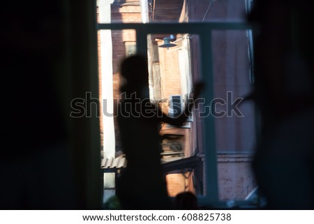 dancers on the background of an open window movement blurred, abstract