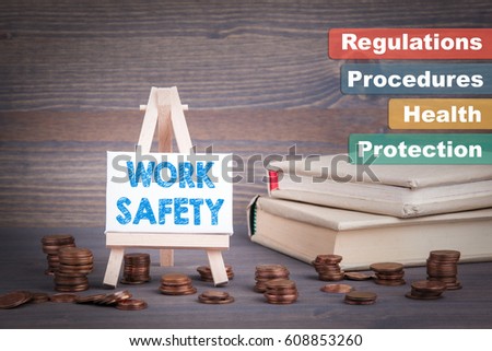 Work Safety Business Concept. Miniature easel with small change