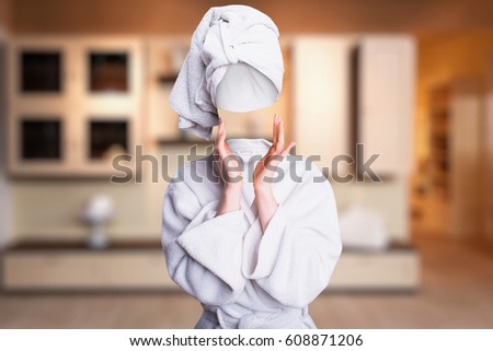 Woman trying to touch her invisible face Royalty-Free Stock Photo #608871206