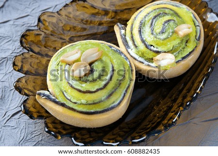 Sweet dessert with kiwi fruit stuffing and nuts