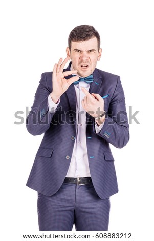 businessman making his fingers the small size. emotions, facial expressions, feelings, body language, signs. image on a white studio background.