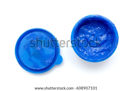 Blue color paint in a jar isolated on white background