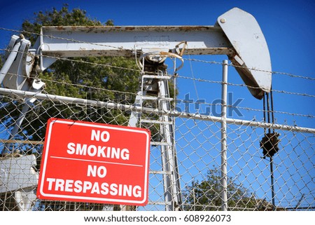 oil derrick with no smoking sign                               