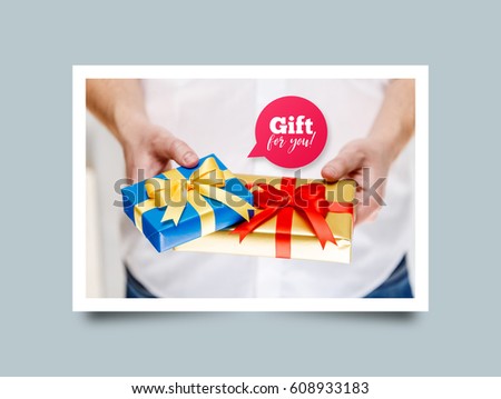Male hands holding a gift boxes. Presents wrapped with ribbon and bow. Gift for you speech bubble. Man in white shirt. Photo frame design with shadow.