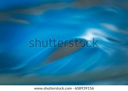 Abstract macro of moving waves on liquid. Water surface macro.
