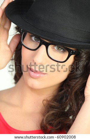 Portrait of a woman with hat and eyeglasses