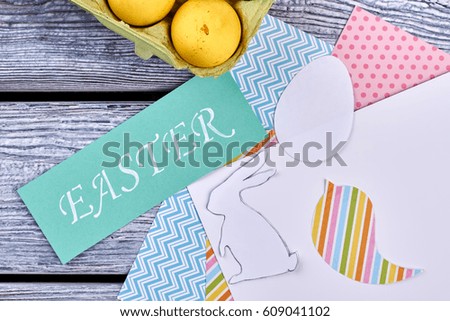 Patterned paper and Easter card. White egg cutout. Easy Easter decoration ideas.