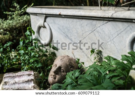 Details of decoration, old ancient  bathtub in the garden